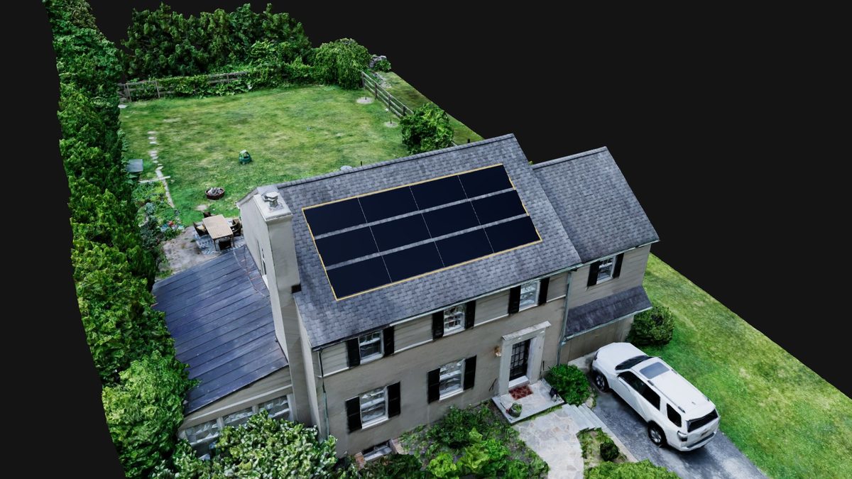 Solar panel layout placed on a roof facet measured from a 3D drone capture